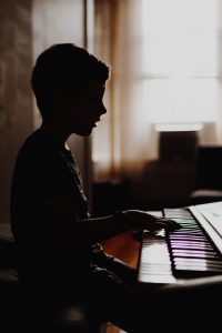 A child learning to play the piano